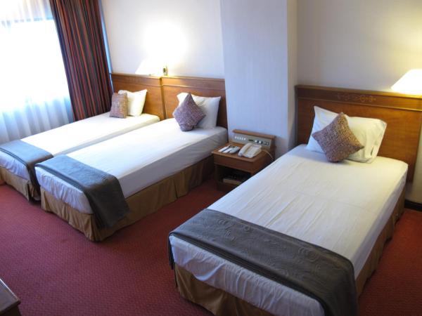 Hotel Grand Continental Kuching : photo 6 de la chambre chambre familiale deluxe