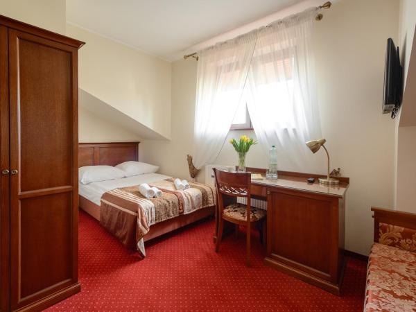 Dworek Vesaria : photo 1 de la chambre chambre double ou lits jumeaux 