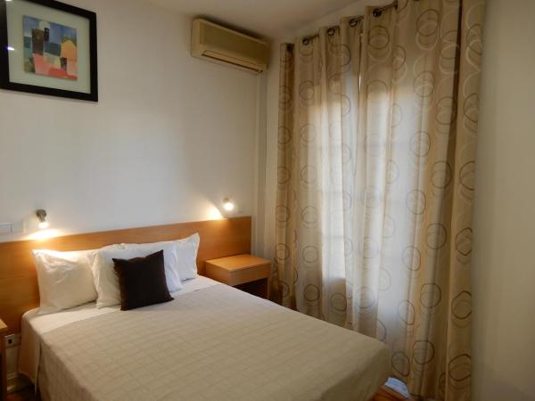 Guesthouse Coimbra City : photo 8 de la chambre chambre familiale