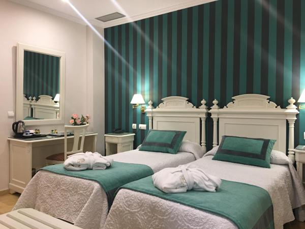 Adriano Boutique Sevilla : photo 6 de la chambre chambre lits jumeaux