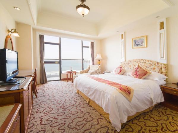 Huiquan Dynasty Hotel Qingdao : photo 2 de la chambre chambre lits jumeaux exécutive avec vue sur la mer