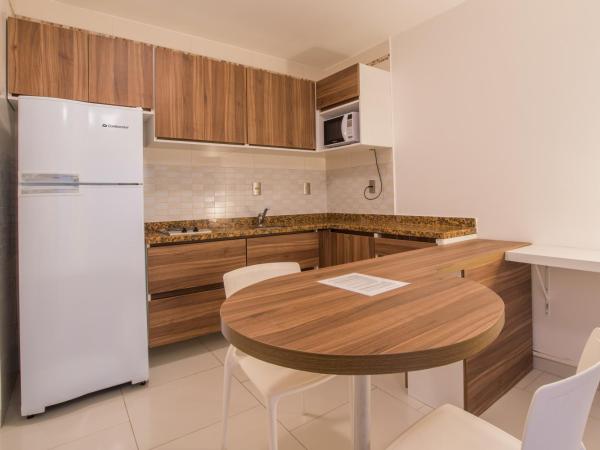 Kristie Resort Natal Hotel : photo 3 de la chambre appartement 1 chambre avec terrasse et vue sur la piscine