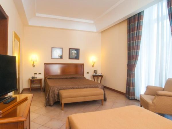 Le Cheminée Business Hotel Napoli : photo 4 de la chambre chambre triple deluxe