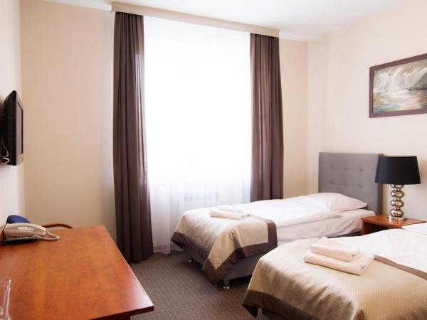 Centrum Konferencyjno-Apartamentowe Mrówka : photo 4 de la chambre chambre lits jumeaux