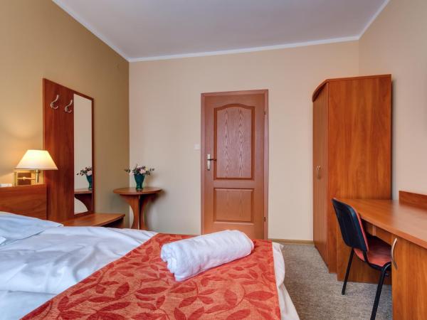 Villa Plaza : photo 2 de la chambre chambre lit king-size ou lits jumeaux supérieure