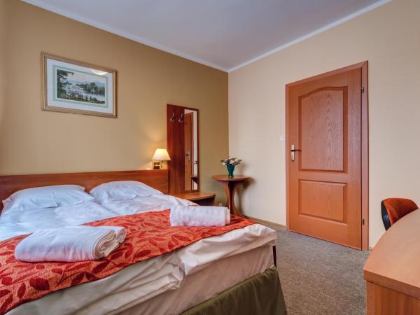 Villa Plaza : photo 1 de la chambre chambre lit king-size ou lits jumeaux supérieure