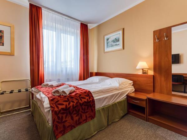 Villa Plaza : photo 3 de la chambre chambre lit king-size ou lits jumeaux supérieure