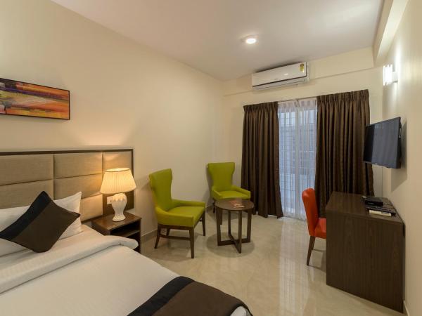 Daffodil Delight - Manyata Tech Park : photo 3 de la chambre chambre double ou lits jumeaux deluxe avec balcon