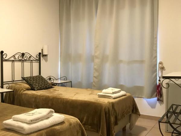 Faro del Parque : photo 1 de la chambre chambre lits jumeaux avec salle de bains