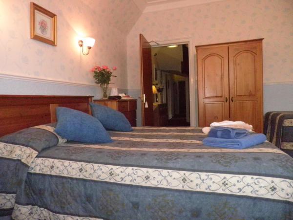 Midway Guest House : photo 1 de la chambre chambre familiale (2 adultes + 1 enfant)
