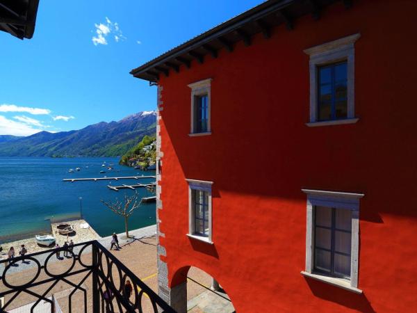 New Elvezia : photo 2 de la chambre chambre lits jumeaux avec balcon - vue latérale sur lac