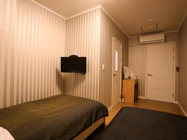 Mama Guesthouse Myeongdong : photo 2 de la chambre chambre lits jumeaux avec salle de bains privative