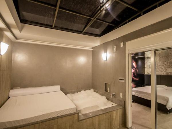 Motel Quo : photo 6 de la chambre chambre lit king-size avec baignoire spa