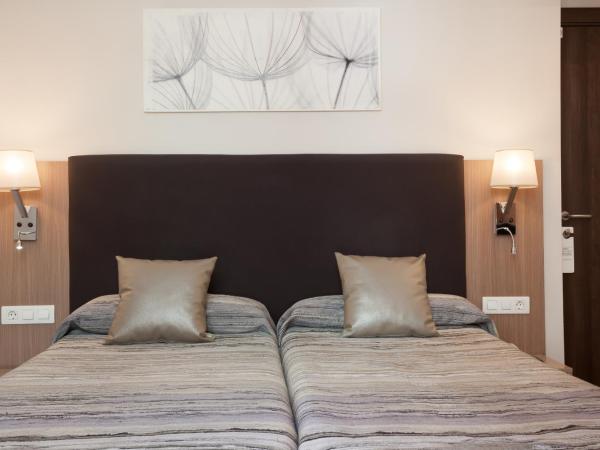 Hostal Centric : photo 4 de la chambre chambre triple