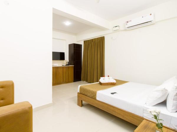 Sanctum Suites Whitefield Bangalore : photo 2 de la chambre chambre supérieure lit queen-size