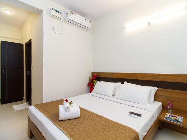 Sanctum Suites Whitefield Bangalore : photo 8 de la chambre chambre lit queen-size deluxe