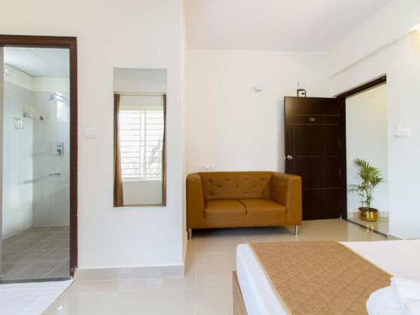 Sanctum Suites Whitefield Bangalore : photo 5 de la chambre chambre supérieure lit queen-size
