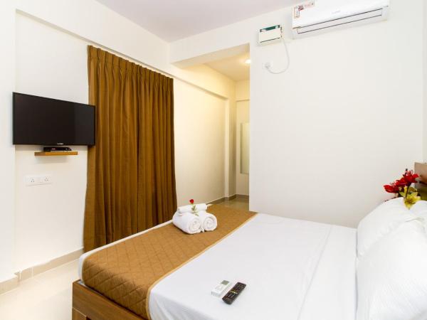 Sanctum Suites Whitefield Bangalore : photo 1 de la chambre chambre lit queen-size deluxe
