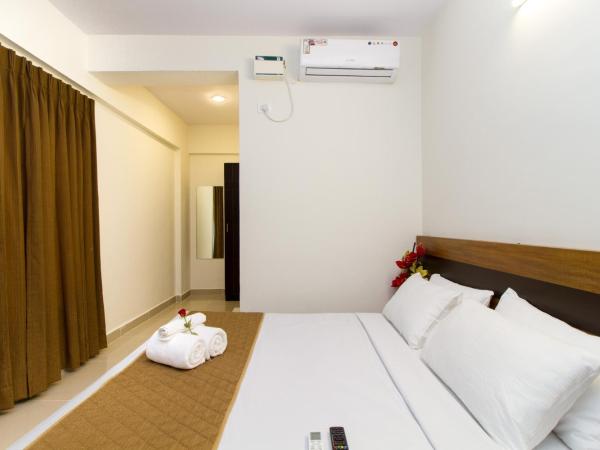Sanctum Suites Whitefield Bangalore : photo 4 de la chambre chambre lit queen-size deluxe