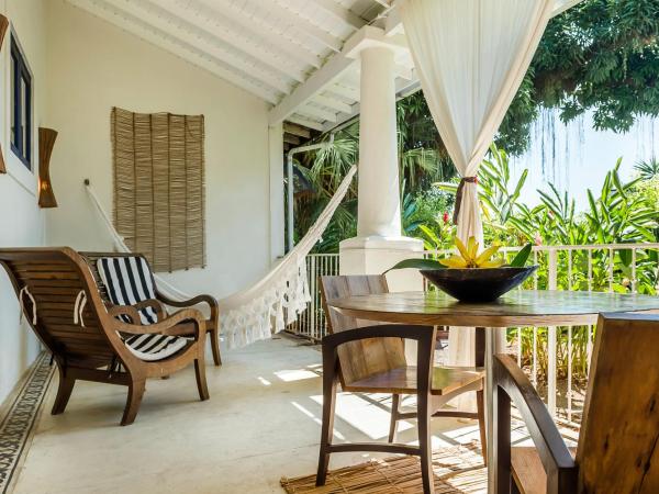 Santa Teresa Hotel RJ - MGallery : photo 1 de la chambre chambre lit king-size de luxe avec balcon et vue