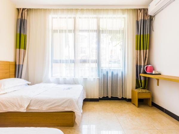 Sanya Passion fruit Inn : photo 3 de la chambre chambre lits jumeaux avec balcon