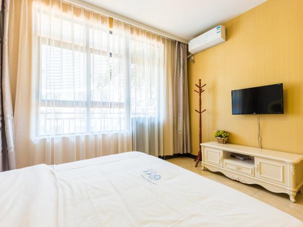 Sanya Passion fruit Inn : photo 4 de la chambre chambre lit queen-size avec balcon