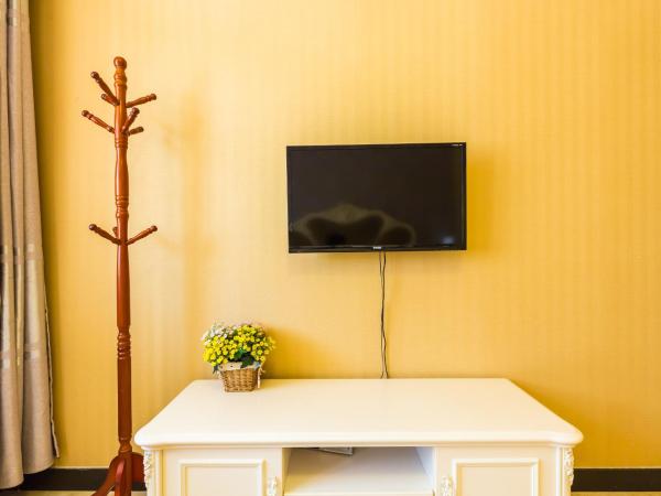 Sanya Passion fruit Inn : photo 5 de la chambre chambre lit queen-size avec balcon