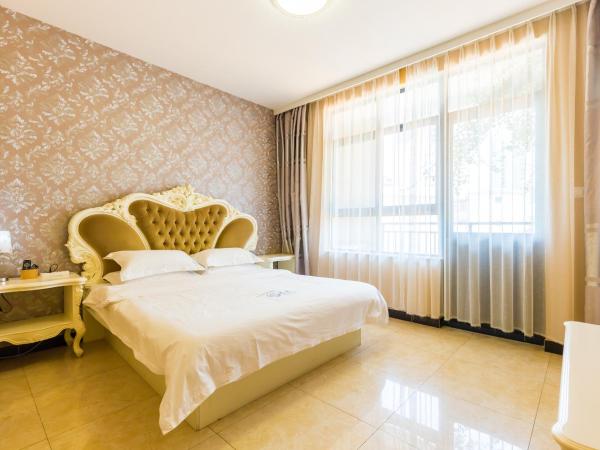 Sanya Passion fruit Inn : photo 3 de la chambre chambre lit queen-size avec balcon