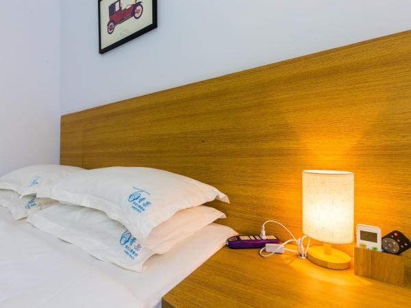 Sanya Passion fruit Inn : photo 4 de la chambre chambre double avec balcon