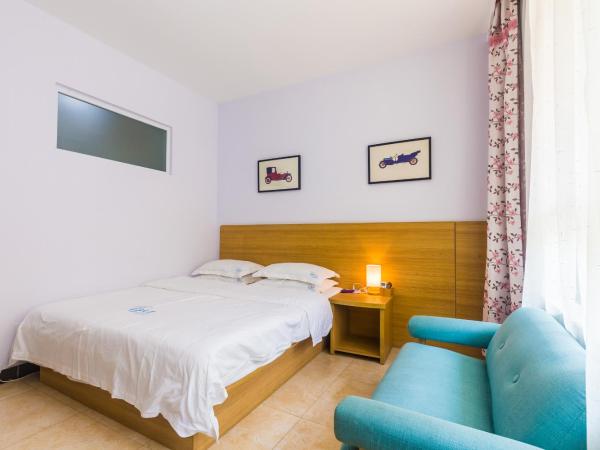 Sanya Passion fruit Inn : photo 2 de la chambre chambre double avec balcon