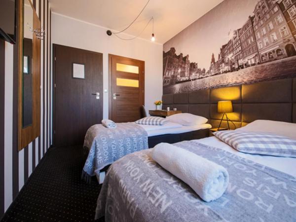 Boogie ApartHouse Old Town : photo 3 de la chambre chambre double ou lits jumeaux avec salle de bains privative