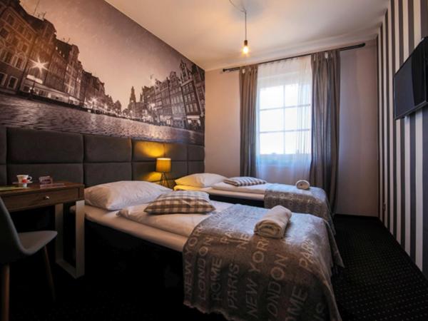 Boogie ApartHouse Old Town : photo 9 de la chambre chambre double ou lits jumeaux avec salle de bains privative