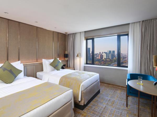 Golden Tulip Shanghai Hongqiao - A Louvre Hotel : photo 2 de la chambre chambre lits jumeaux deluxe