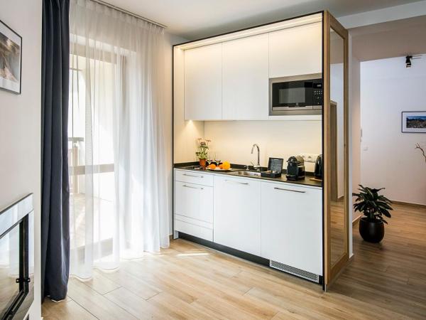 Apartamenty Forma Tatrica : photo 5 de la chambre appartement 2 chambres deluxe avec cheminée et balcon ou terrasse