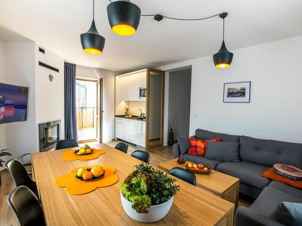 Apartamenty Forma Tatrica : photo 4 de la chambre appartement 2 chambres deluxe avec cheminée et balcon ou terrasse