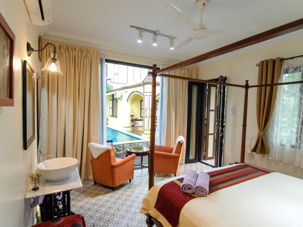 Casugria Dutch Residence 1810 : photo 3 de la chambre chambre lit king-size - vue sur piscine