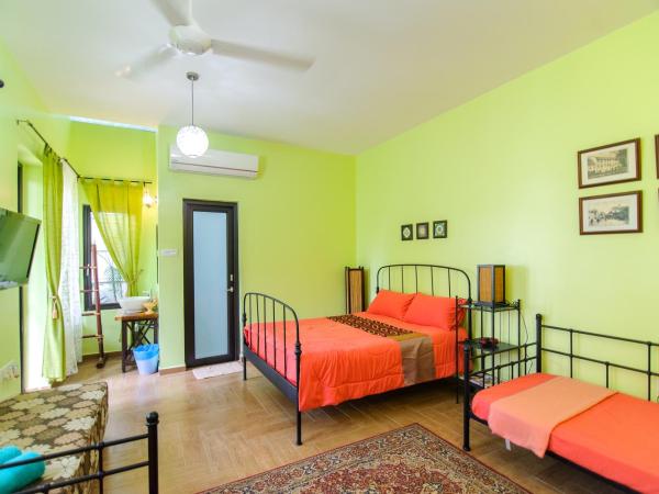 Casugria Dutch Residence 1810 : photo 2 de la chambre chambre familiale - vue sur jardin