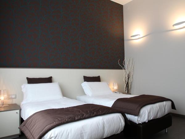 Hotel Tiziano - Gruppo Mini Hotel : photo 2 de la chambre chambre lits jumeaux - vue sur parc