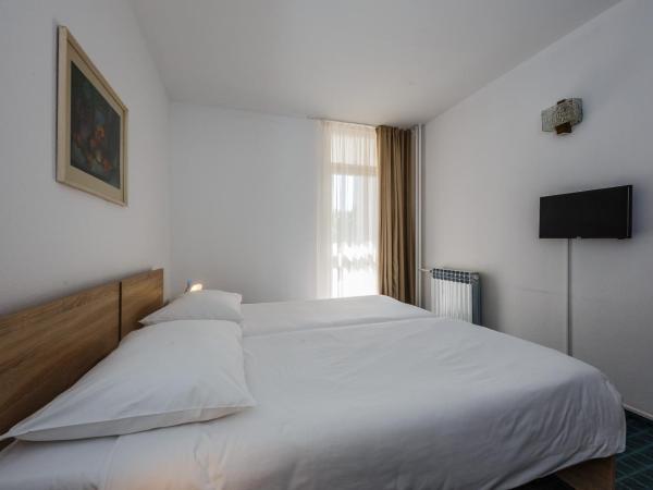 Hotel Medena Budget : photo 9 de la chambre chambre double ou lits jumeaux standard - vue sur jardin