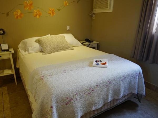 Villa Brasil Motel : photo 4 de la chambre chambre double deluxe avec lit d'appoint