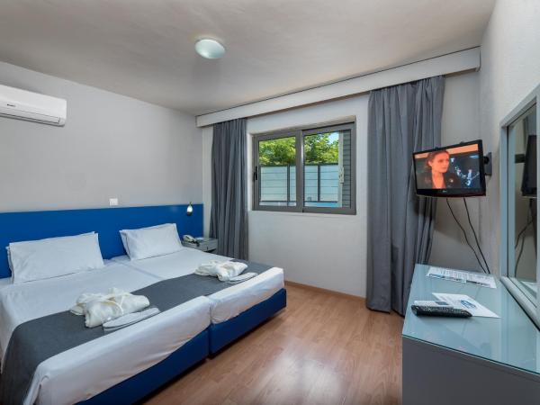 7Palms : photo 2 de la chambre appartement 2 chambres (2-4 adultes) - rez-de-chaussée 