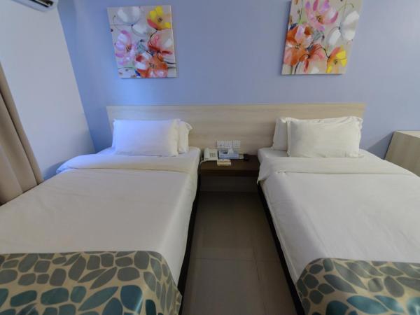 Samudra Hotel Kuching : photo 3 de la chambre chambre lits jumeaux