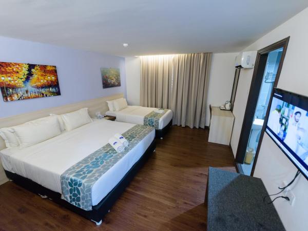 Samudra Hotel Kuching : photo 1 de la chambre chambre triple