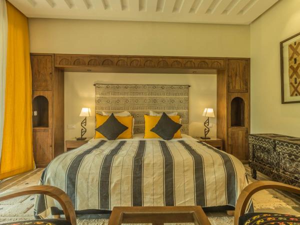 Villa Le Perroquet Bleu : photo 10 de la chambre suite lit queen-size deluxe