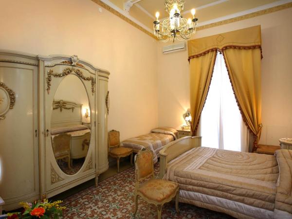 B&B Il Caravaggio : photo 4 de la chambre chambre triple avec salle de bains privative