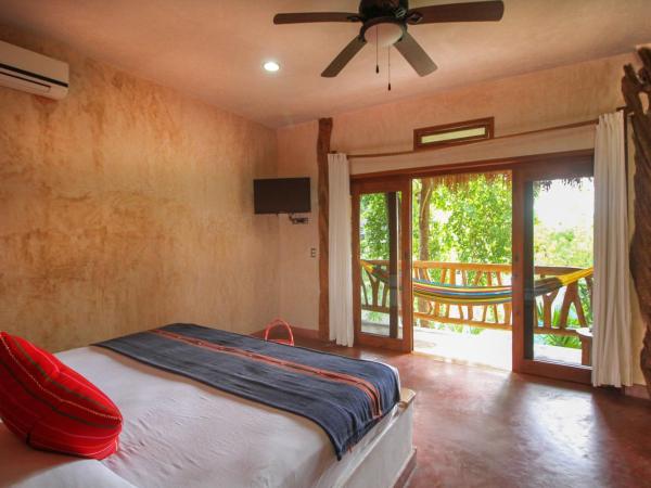 Corazon De Jade Tulum : photo 2 de la chambre room with king bed with balcony garden view and private bathroom