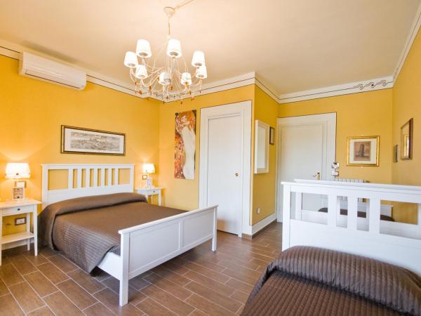 Hotel Pisa Tower : photo 1 de la chambre chambre quadruple Économique - bâtiment séparé