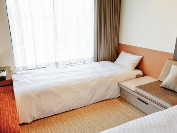 Candeo Hotels Tokyo Roppongi : photo 7 de la chambre chambre lits jumeaux exécutive à occupation triple