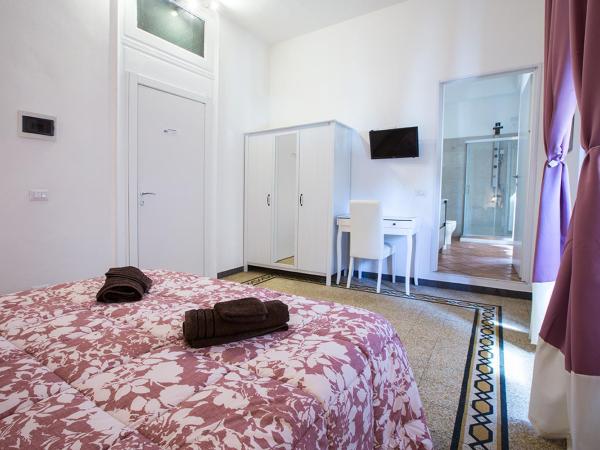 Suite Cagliaritane Notti in centro : photo 1 de la chambre chambre triple deluxe