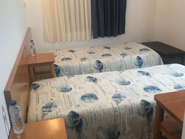 Rimavier Residence : photo 3 de la chambre chambre lits jumeaux avec salle de bains privative